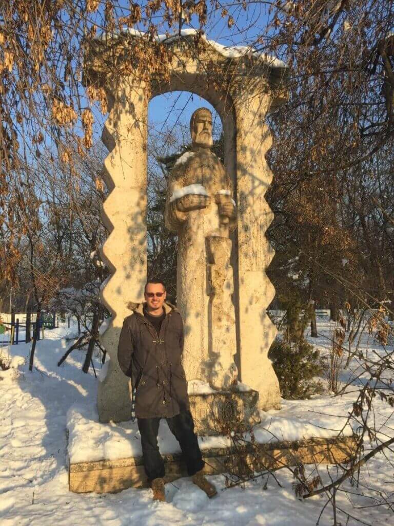 Emanuel P in Bucharest in front of Brancusi statue in Herastrau Park